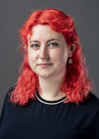 Headshot of woman with red hair